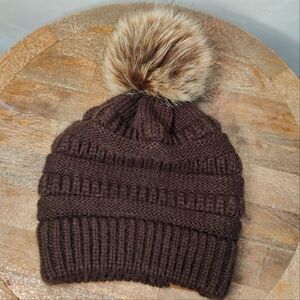 Fall beanie with adorable pompom on top. Hat is knit style and is One size
